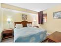 Cozy bedroom with a queen-sized bed and decorative lamps at 1604 N Ocean Blvd. # 903, Myrtle Beach, SC 29577