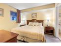 Cozy bedroom featuring a bed, soft lighting, and a connected bathroom at 1604 N Ocean Blvd. # 904, Myrtle Beach, SC 29577