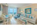 Relax in this sun-filled living room with stylish furniture and an ocean view at 200 76Th Ave. N # 1211, Myrtle Beach, SC 29572