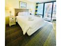 Comfortable bedroom with a queen bed and a balcony view to the outside at 2311 S Ocean Blvd. # 144, Myrtle Beach, SC 29577