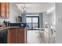 Cozy kitchen with sleek countertops, essential appliances, and an adjacent living area with ocean view balcony at 2600 N Ocean Blvd. # 807, Myrtle Beach, SC 29577