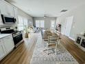 Open-concept living space with modern kitchen, dining area, and comfortable living room at 2604 Willow St., North Myrtle Beach, SC 29582