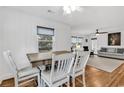 Dining area with hardwood floors and adjacent living room at 313 73Rd Ave. N, Myrtle Beach, SC 29572