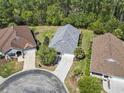 This aerial view showcases the home's roof, driveway, and landscaping at 320 Cog Hill Ct., Murrells Inlet, SC 29576