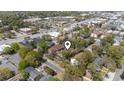 Aerial view of a residential neighborhood with tree-lined streets and nearby commercial areas at 404 75Th Ave. N # E, Myrtle Beach, SC 29572