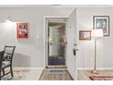Inviting entryway with neutral decor, artwork, and a 'Welcome' mat at 404 75Th Ave. N # E, Myrtle Beach, SC 29572
