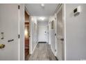 Hallway with hardwood floors, white walls, doors and a closet at 5905 S Kings Hwy. # A551, Myrtle Beach, SC 29575