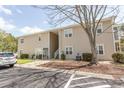 Exterior view of condos on a sunny day with parking nearby and nice walkway at 6207 Sweetwater Blvd. # 6207, Murrells Inlet, SC 29576