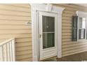 Close up of the front door of condo with sidelight and great door hardware at 6207 Sweetwater Blvd. # 6207, Murrells Inlet, SC 29576