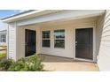 Covered front porch with dual entry doors and neutral siding at 632 Culmen Ct., Myrtle Beach, SC 29588