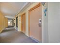 Hallway view with doors and room number signs in a hotel or condo building at 6900 N Ocean Blvd. # 735, Myrtle Beach, SC 29572