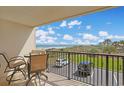 Enjoy ocean views from the balcony with a table, chairs and tile flooring, perfect for relaxation at 741 Retreat Beach Circle # B-1-F, Pawleys Island, SC 29585