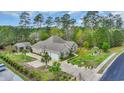 Expansive aerial view showcases the home's well-maintained lawn, long driveway, and large two-car garage at 152 Creek Harbour Circle, Murrells Inlet, SC 29576