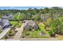 Beautiful home surrounded by lush greenery, manicured lawns, and mature trees creating a private oasis in a desirable neighborhood at 152 Creek Harbour Circle, Murrells Inlet, SC 29576