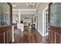 Inviting foyer featuring gleaming hardwood floors, high ceilings, and an open view into the spacious living areas at 152 Creek Harbour Circle, Murrells Inlet, SC 29576
