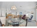 Bright living and dining area featuring a ceiling fan, beach decor and an open floorplan at 202 56Th Ave. N, North Myrtle Beach, SC 29582