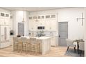 Open kitchen featuring white cabinets, a large island with seating, pendant lights and modern appliances at 346 Ridge Rd., Galivants Ferry, SC 29544