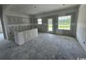 Unfinished open-concept kitchen featuring new windows and an island perfect for modern living at 384 William Nobles Rd., Aynor, SC 29511