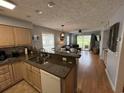 Open concept living area with wood floors and combined kitchen space at 569 Blue River Ct. # 9-A, Myrtle Beach, SC 29579
