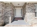 Charming front porch with a brick facade, providing a welcoming entrance to the home at 657 Lantern Ct., Longs, SC 29568