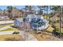 Aerial view of home with mature trees, large lot, and circular drive at 901 Bear Lake Dr., Longs, SC 29568