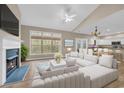 Bright living room with fireplace, large windows, and an open floor plan at 1545 Spinnaker Dr. # 2C, North Myrtle Beach, SC 29582