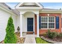 Close-up of the front entrance with brick facade and a cozy, welcoming doormat at 232 Marbella Dr., Murrells Inlet, SC 29576