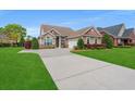 Beautiful home with a well-maintained lawn and a long, spacious driveway at 826 Sand Binder Dr., Myrtle Beach, SC 29579