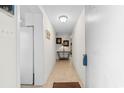 Bright hallway with a round, decorative table and a tiled floor at 10100 Lakeshore Dr. # C-1, Myrtle Beach, SC 29572