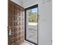 Open door reveals the entryway with a partial outside view at 1012 Possum Trot Rd. # C21, North Myrtle Beach, SC 29582