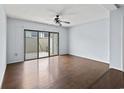 Empty living room with hard wood floors and sliding glass doors to the outside at 1012 Possum Trot Rd. # C21, North Myrtle Beach, SC 29582