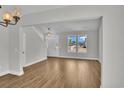 Bright and airy living room featuring luxury vinyl plank flooring and views of the neighborhood at 1105 Nw Forest Bend Dr., Calabash, NC 28467