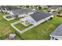 Aerial shot of a home's backyard with a white picket fence and patio area at 1130 Ganton Way, Myrtle Beach, SC 29588