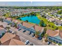 Aerial view of condo building, showcasing a scenic pond and lush landscaping throughout the community at 117 Butkus Dr. # 5, Myrtle Beach, SC 29588