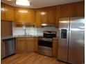 Kitchen featuring stainless steel appliances, granite countertops, and wood cabinets at 1208 Mackie Circle, Myrtle Beach, SC 29579