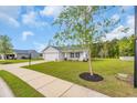 A nice house with a well-maintained lawn, a driveway, and lush landscaping at 1340 Valor Rd., Conway, SC 29527