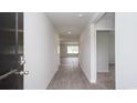 Inviting entryway with hardwood floors and neutral paint, leading into the home's living spaces at 144 Ashworth Dr., Tabor City, NC 28463