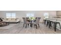 Bright dining area featuring a glass table with seating for four, open to the living area at 147 Ashworth Dr., Tabor City, NC 28463