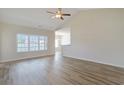 Bright living room with vaulted ceiling, ceiling fan, and hardwood floors at 200 Palm Terrace Loop, Conway, SC 29526