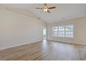Bright living room with vaulted ceiling, ceiling fan, and hardwood floors at 200 Palm Terrace Loop, Conway, SC 29526