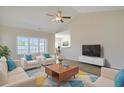 Bright living room with vaulted ceiling, ceiling fan, and lots of natural light at 200 Palm Terrace Loop, Conway, SC 29526