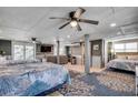 Spacious bedroom with two beds, ceiling fan and large TV, offering plenty of room to relax at 329 46Th Ave. N, North Myrtle Beach, SC 29582