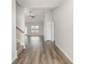 Spacious living room features beautiful hardwood floors and lots of natural light from a large window at 364 Hayloft Circle, Conway, SC 29526
