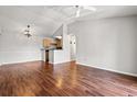 Bright living room boasts hard floors, neutral walls, and chandelier lighting at 3741 Block House Way # 736, Myrtle Beach, SC 29577