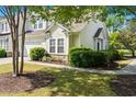 View of the home showing stone accents, lush shrubbery, and a walkway at 6095 Catalina Dr. # 616, North Myrtle Beach, SC 29582