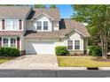 Charming home with a two-car garage, tidy landscaping, and a well-maintained lawn at 6095 Catalina Dr. # 616, North Myrtle Beach, SC 29582