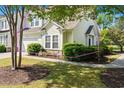 View of the home showing stone accents, lush shrubbery, and a walkway at 6095 Catalina Dr. # 616, North Myrtle Beach, SC 29582