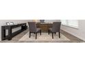 Home office with dark wood floors and furniture, including a desk with chairs and console table at 71 Ashworth Dr., Tabor City, NC 28463
