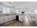 Bright, open kitchen with white cabinets, granite countertops, and stainless steel appliances at 811 N Ocean Blvd. # 401, Surfside Beach, SC 29575