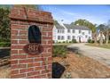 Elegant brick sign displaying the address, complemented by a view of the traditional home at 817 Evans Rd., Marion, SC 29571
